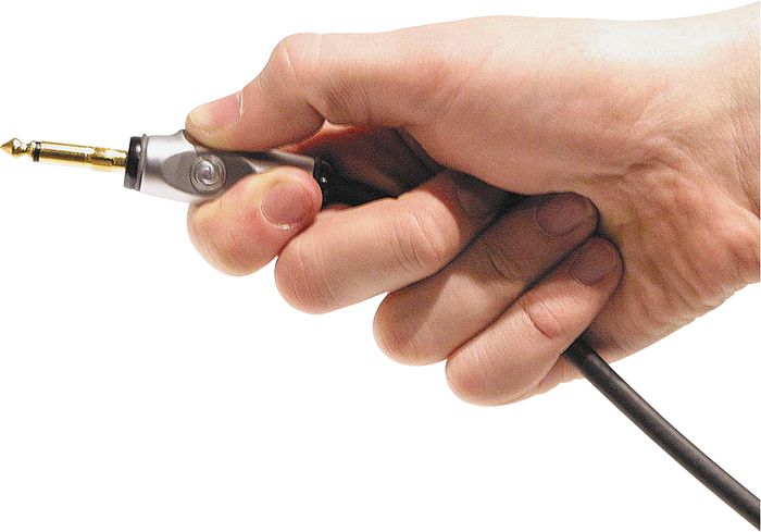 Hands On Review Planet Waves Instrument Cables The Hub Holding A Planet Waves Circuit Breaker Instrument Cable