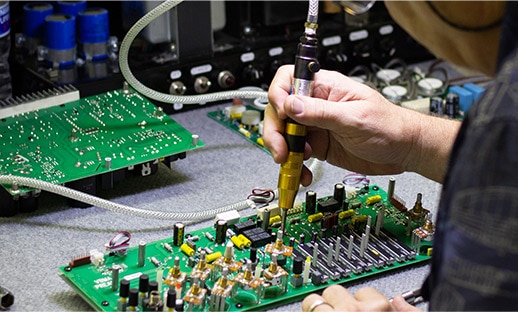 engineer working on circuit board