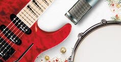 Electric Guitar, microphone, and tambourine accompanied with festive mini gold and green ornaments and sprigs of pine