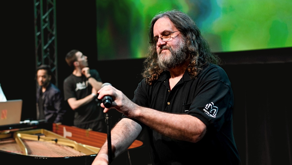 Wayne Sowder adjusts a microphone at the Carolina Theater at Moogfest 2019